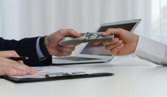 Exchanging Money between hands at desk