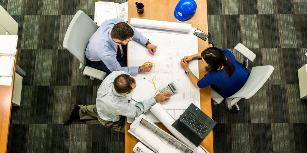 staffing firm employees sitting at a conference room table