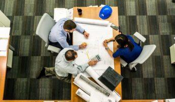 staffing firm employees sitting at a conference room table