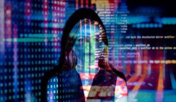 AI tech tools for staffing make it easy for staffing agencies to save time and money. This photo is of a person in a dark room with colorful lines of code being projected over their face and upper body.
