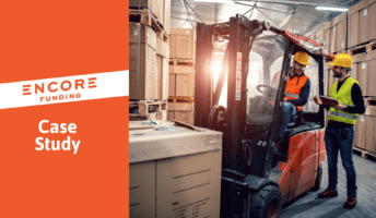 Two light industrial temps work in a warehouse