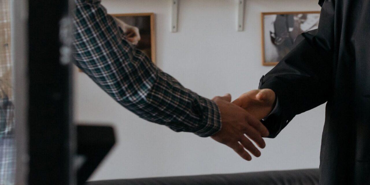 Two colleagues shaking hands