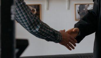 Two colleagues shaking hands